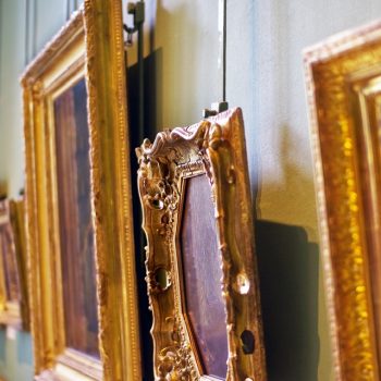 Old paintings in golden frames